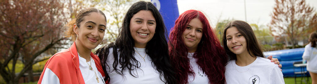 Three female students smiling