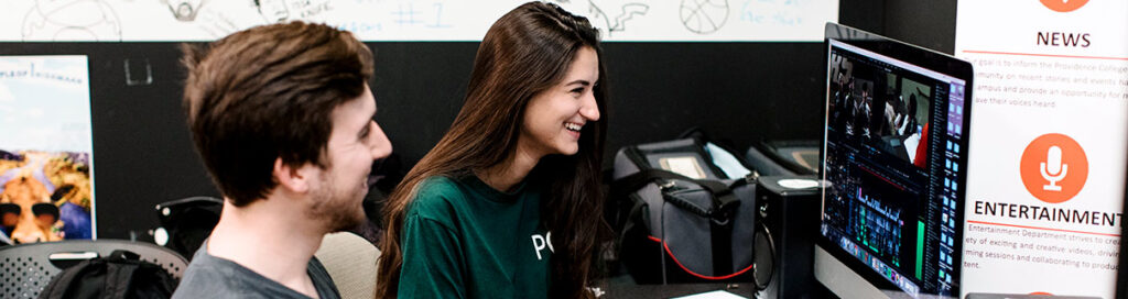 two students working on a club project together