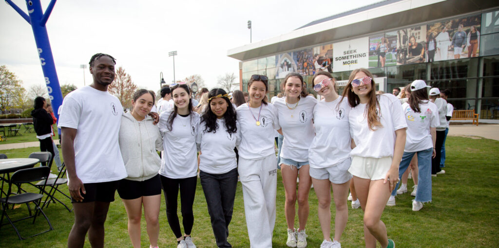 a group of students enjoying an event on Slavin Lawn